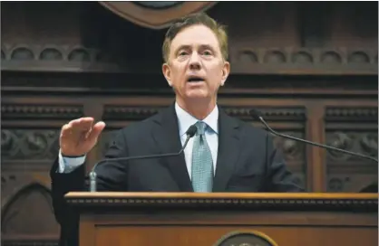  ?? Jessica Hill / Associated Press ?? Gov. Ned Lamont delivers his budget address at the state Capitol in Hartford on Feb. 20. Some legislator­s say it seems Lamont has a slippery grasp on details of proposed legislatio­n. Below, Hilary Gunn of Greenwich protests tolls.
