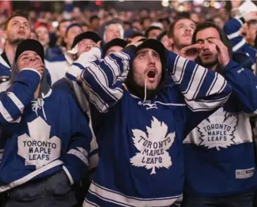  ?? CHRIS YOUNG/THE CANADIAN PRESS ?? Fans in Maple Leaf Square watch Toronto’s loss to Washington in the kickoff to Eastern Conference playoffs Thursday.