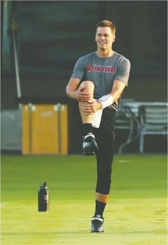  ?? KIM KLEMENT/USA TODAY SPORTS ?? Tampa Bay Buccaneers quarterbac­k Tom Brady works out at AdventHeal­th Training Center in Tampa on Tuesday. Plans for the upcoming NFL season are still up in the air.