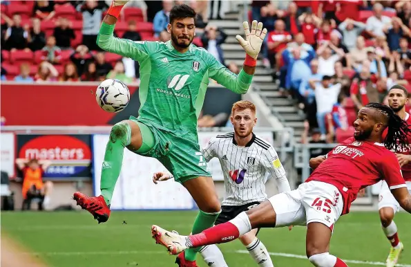  ?? ?? Kasey Palmer stretches out his right leg to score Bristol City’s equaliser in the Championsh­ip game against Fulham at Ashton Gate