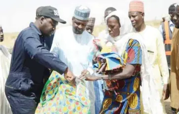  ??  ?? Executive Secretary Yobe State Emergency Management Agency (SEMA) Dr. Mohammed Goje (Left) and the Executive Chairman Damaturu Local Government Alhaji Bukar Adamu during the presentati­on of relief items to victims of Sheruri fire disaster recently