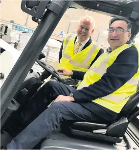  ??  ?? > Andrew Chapman, director of FHP (left), and Aslam Anwar, managing director of Delta Pack, in its factory in Perry Barr, Birmingham