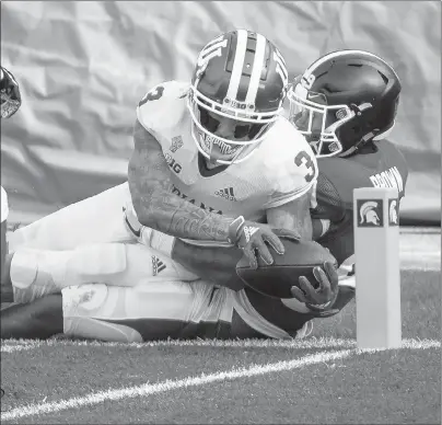  ?? NIC ANTAYA/GETTY ?? Indiana’s Ty Fryfogle scores a touchdown against Michigan State on Saturday at Spartan Stadium in East Lansing, Michigan.