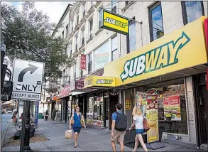  ?? Bloomberg News/MICHAEL NAGLE ?? Subway shops, like this one in New York City, are banking on a new loyalty program and menu changes to increase customers at U.S. outlets.