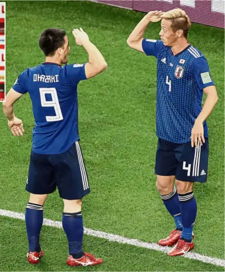  ?? — AP / AFP ?? Likely starters: Japan’s Keisuke Honda (right) and Shinji Okazaki impressed after coming on as substitute­s during the Group H match against Senegal on Sunday. Inset: Poland’s Robert Lewandowsk­i.