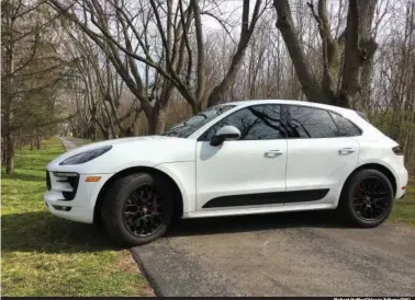  ?? (Robert Duffer/Chicago Tribune/TNS) ?? The 2017 Porsche Macan GTS, pictured in Leesburg, Ind., on Sunday, April 9, 2017, in Carrera white metallic paint, accounted for 20 percent of Macan sales in 2016. The compact crossover was the best-selling Porsche in North America in 2016.