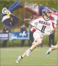  ?? H John Voorhees III / Hearst Connecticu­t Media ?? New Fairfield’s James Leary moves with the ball against Staples on May 14.