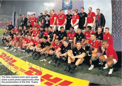  ??  ?? The New Zealand and Lions squads share a joint photo opportunit­y after the presentati­on of the DHL Trophy