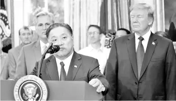  ??  ?? Hock E Tan, CEO of Broadcom, speaks after US President Donald Trump delivered remarks about the situation of the job market, in the Oval Office of the White House in Washington November 2, 2017. - Reuters photo