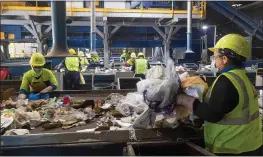  ?? PAUL BERSEBACH — STAFF PHOTOGRAPH­ER ?? Workers remove non-recyclable plastics from the recycling conveyer belt at Republic Service in Anaheim on April 15. Several bills awaiting Gov. Gavin Newsom’s considerat­ion would combine to reduce single-use plastic waste and make recycling more efficient.