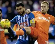  ??  ?? Scott Arfield jostles with Gary Dicker