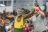  ?? ?? Great Bridge’s Myrin Nixon has his arm raised after defeating Handley’s Nick Baker for the 132-pound Class 4 state title.