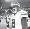  ?? JOHN FROSCHAUER/AP ?? Vikings quarterbac­k Kirk Cousins walks off the field after the team lost to the Seahawks 37-30 on Monday.