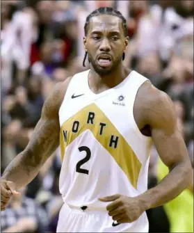  ?? FRANK GUNN – THE ASSOCIATED PRESS ?? Raptors forward Kawhi Leonard celebrates the team’s win against the Trail Blazers in a game on March 1, in Toronto.