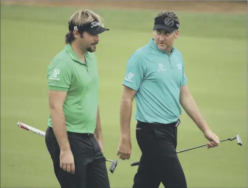  ?? Picture: Getty Images ?? France’s Victor Dubuisson and England’s Ian Poulter at the eighth hole during yesterday’s first round in Shanghai