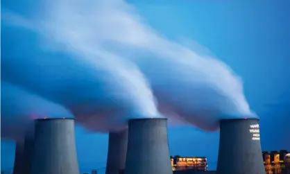  ?? Photograph: Christophe Gateau/dpa/AFP via Getty Images ?? Smoke and vapour rising from the cooling towers and chimneys of the lignite-fired Jänschwald­e power plant in eastern Germany.