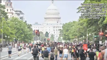  ??  ?? Demonstrat­ors hold a protest in response to the police killing of George Floyd near the US Capitol in Washington, DC. — AFP photo