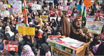  ??  ?? Demonstrat­ors shout slogans during a protest rally against the new citizenshi­p law, in Bengaluru.