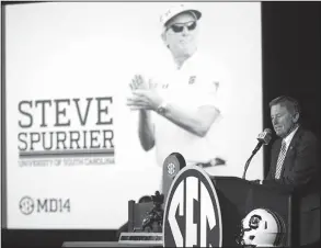  ??  ?? Disclosing his thoughts: South Carolina football coach Steve Spurrier speaks to media at the Southeaste­rn Conference media days, Tuesday, in Hoover, Ala.