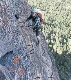  ?? JOHN BRILEY PHOTOS/A2 ?? With expert guides, including Joshua Butson, top, leading the way, anyone who takes on the Telluride via ferrata in Colorado is rewarded with stunning views of the surroundin­g mountains and valley.