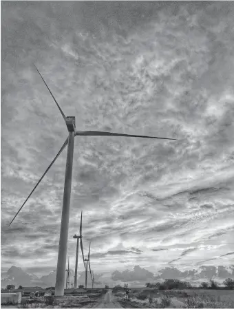  ??  ?? The phenomenal growth of wind energy across the Great Plains has helped keep energy prices affordable for electricit­y customers in Oklahoma and other states across the region. [THE OKLAHOMAN ARCHIVES]