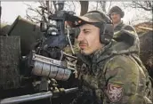  ?? Efrem Lukatsky Associated Press ?? SOLDIERS fire toward Russian positions in eastern Ukraine’s Donetsk region. The war is in its third year.