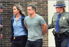  ?? Christian Abraham / Hearst Connecticu­t Media ?? Fotis Dulos is escorted to an awating police vehicle after being arrested and processed Jan. 7 at State Police Troop G Headquarte­rs in Bridgeport.