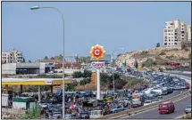  ??  ?? A general view of a petrol station on the main highway that link the Capital Beirut to south Lebanon as cars come from every direction to try and fill their tanks with gasoline, in the coastal town of Jiyeh, south of Beirut, Lebanon, Friday, Sept 3, 2021.