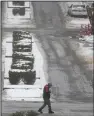  ?? (AP/George Walker IV) ?? A person crosses the street on Thursday in Nashville, Tenn.