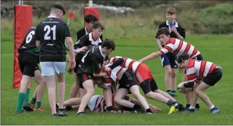  ??  ?? Pobalscoil Chorca Dhuibhne keeping Mercy Mounthawk Tralee under pressure as they pressed forward for another try in their comprehens­ive McCarthy Cup under-15 match in Carraig.