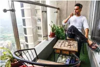  ??  ?? A 29-year-old television anchor Lakshay Narula sips tea at his home in Mumbai. Inspired by Bollywood actors and cricket superstars, Indian men are splashing out on grooming products and subverting macho stereotype­s that have long defined ideas of masculinit­y in the patriarcha­l country.