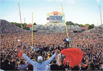  ?? FILE PHOTO BY CHRISTOPHE­R HANEWINCKE­L, USA TODAY SPORTS ?? Monumental victories, such as Mississipp­i’s against Alabama in 2014, are reason for mass celebratio­ns in Southeaste­rn Conference territory.