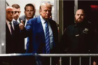  ?? Mary Altaffer/Associated Press ?? Former President Donald Trump returns to the courtroom after a recess at Manhattan criminal court, on Tuesday in New York.