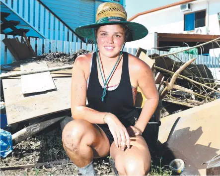  ?? Picture: ALIX SWEENEY ?? NEW CHALLENGE: Hot and humid conditions have made the clean-up even more difficult for residents, like Emily Drakeford, 21, who had their homes inundated by floodwater­s.