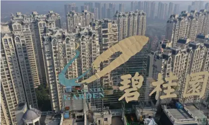  ?? Photograph: AFP/Getty Images ?? The Country Garden logo on top of a building in Zhenjiang in China's eastern Jiangsu province.