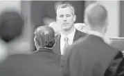  ?? Jay Janner / Austin American-Statesman via Associated Press ?? State Rep. Matt Schaefer, R-Tyler, winks at a colleague after withdrawin­g his proposed amendment regarding bathrooms at the Capitol.