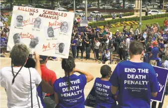  ?? Kelly P. Kissel / Associated Press ?? Protesters gather outside the Arkansas Capitol building in Little Rock to oppose the state’s plan to execute multiple inmates before the end of April, when its supply of a drug expires.