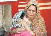  ?? MUKHTAR KHAN/AP ?? Kousain Ajaz, whose braid was chopped off by unidentifi­ed assailants, is comforted by her mother inside their home.