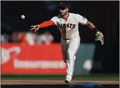  ?? NHAT V. MEYER — BAY AREA NEWS GROUP ?? The Giants' David Villar tosses the ball to first base for an out against the Arizona Diamondbac­ks during a game last season.