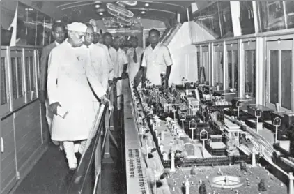  ?? HT FILE ?? Prime Minister Jawaharlal Nehru inspecting some of the exhibits of a railways exhibition before the launch of two special trains in 1953. At present, some areas of the Indian Railways have been privatised.