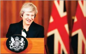  ?? MATT DUNHAM/AFP ?? Britain’s Prime Minister Theresa May gives a press conference inside 10 Downing Street in central London on Thursday. She will be in Brussels later in the week to meet the head of the EU commission, Jean-Claude Juncker, for last-minute Brexit talks.