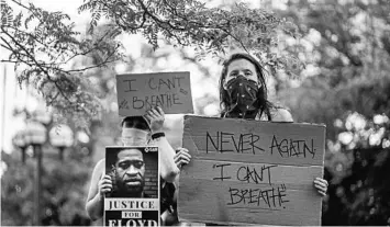  ?? KEREM YUCEL/GETTY-AFP ?? Protesters call for justice for George Floyd, a black man who died after a white policeman knelt on his neck in Minneapoli­s.