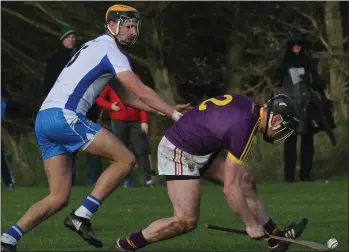  ??  ?? Wexford defender Andrew Kenny is put under pressure by Waterford top scorer Maurice Shanahan.