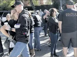  ??  ?? BRENDAN KELLY, left, hugs a friend at Sunday’s gathering. Kelly, 22, said he is a survivor of last year’s shooting at the Route 91 Harvest festival in Las Vegas.