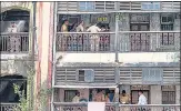 ?? HT PHOTO ?? Cops at the corridor where the accused stabbed five of his neighbours on Friday.