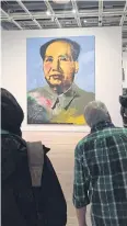  ??  ?? People look at Mao (1972) by Warhol.