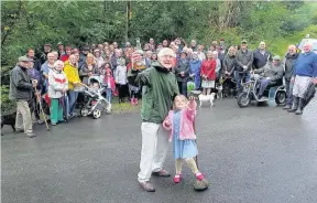  ??  ?? Landmark Professor John Forty and Evie Allan christen the cairn