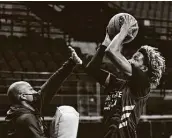  ?? Billy Calzada / Staff Photograph­er ?? COVID-19 forced interim coach Terrence Johnson, left, to miss the last three regular-season games.