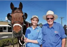  ??  ?? Helping with the horses is Ellie and her grand-father, Harry Adams.