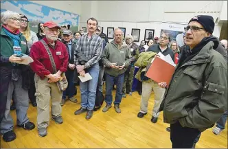  ?? The Associated Press ?? Protest organizer Russell Mokhiber gathers the crowd Thursday at the Hancock, Md., community centre during a TransCanad­a open house to explain a proposed gas pipeline beneath the Potomac River.